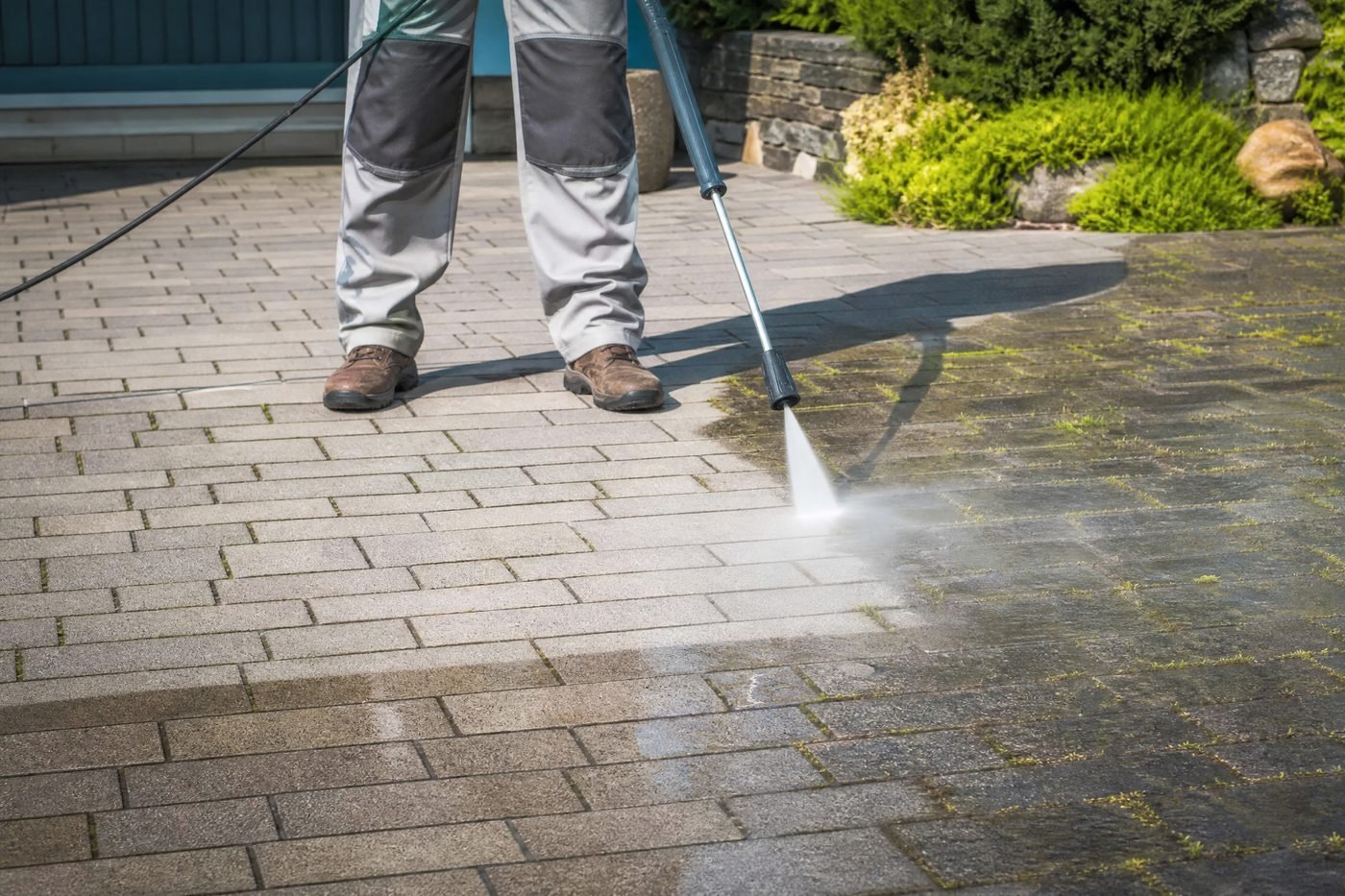 Close-up before and after paver cleaning showing color restoration