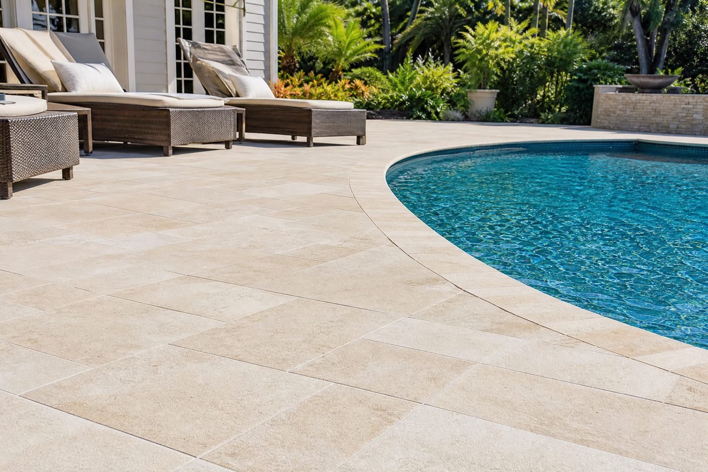 Immaculate pool deck with lounge chairs after professional cleaning